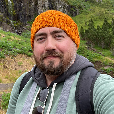 red crab logo holding paintbrush